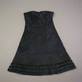 Black dress on a tiled floor